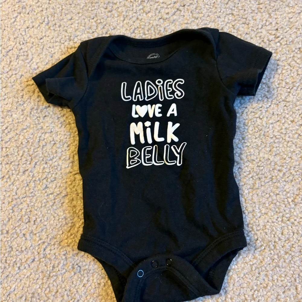 wonder nation Black Baby Bodysuit with White Text “ladies love a milk belly” - Picture 2 of 4